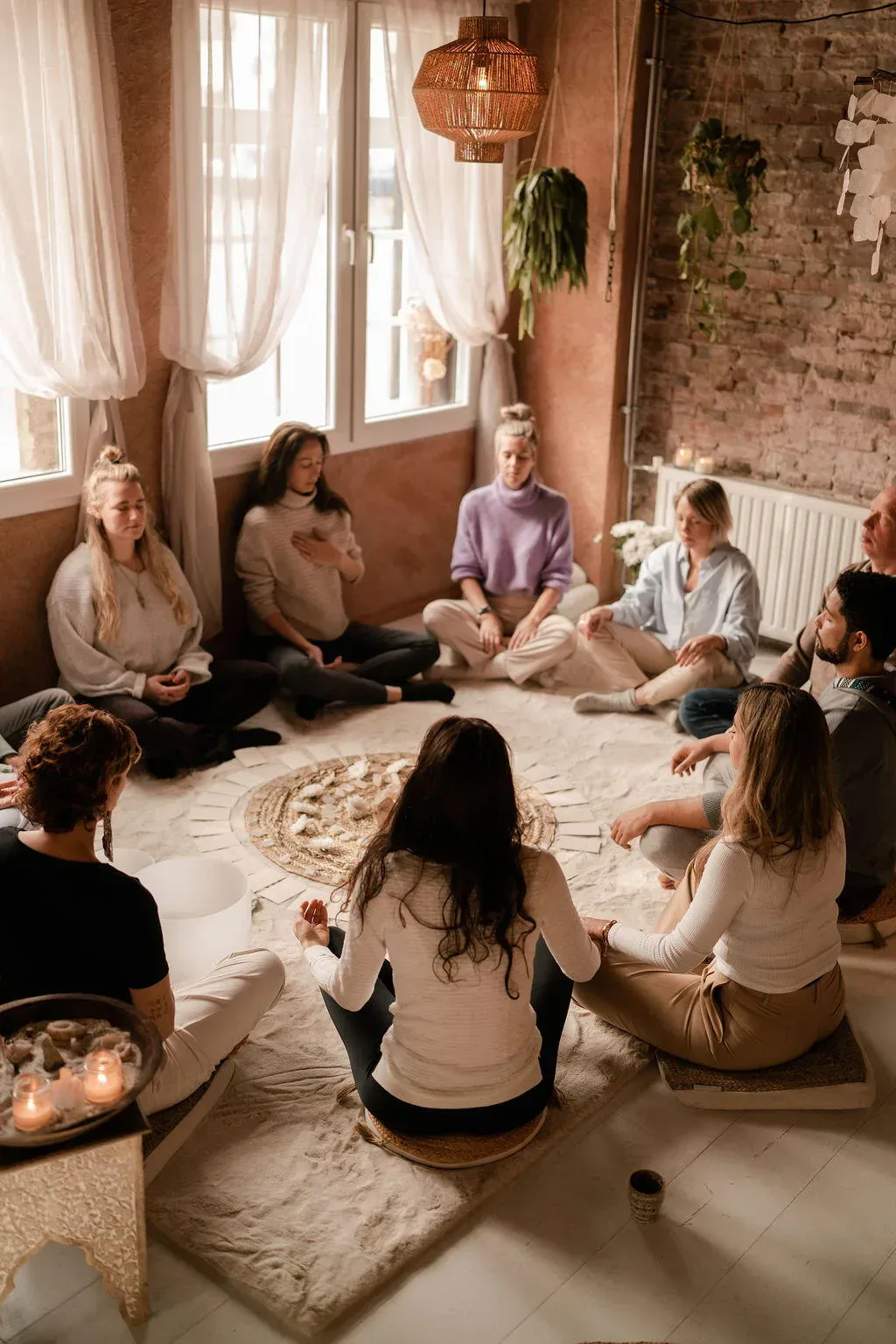 A circle of people during a cacao ceremony