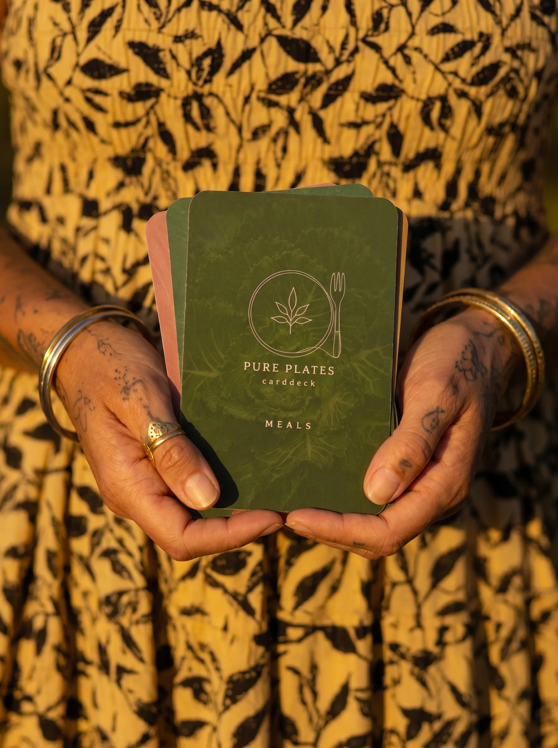The green Meals deck in Eva's hands
