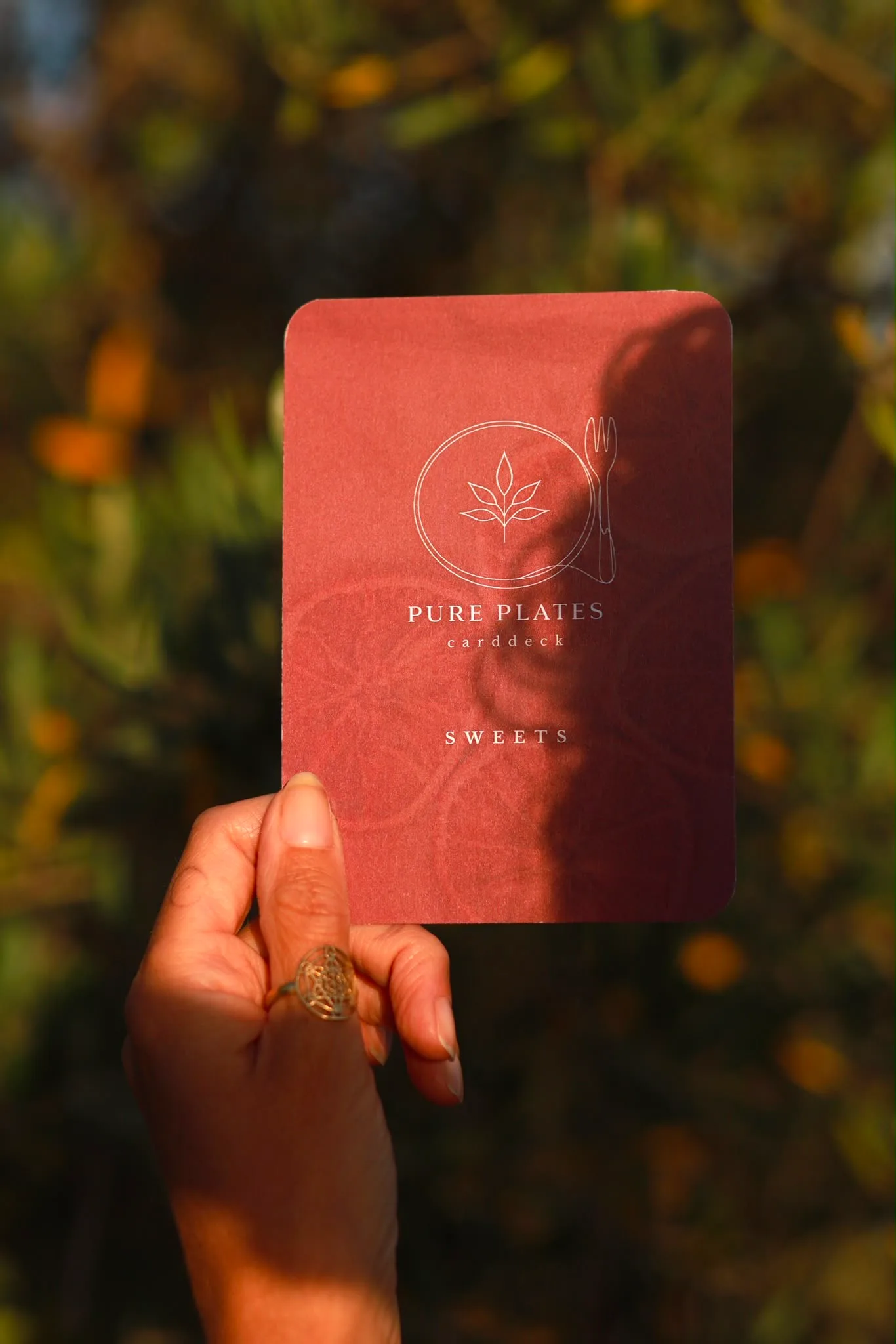 A Sweets card among the flowers
