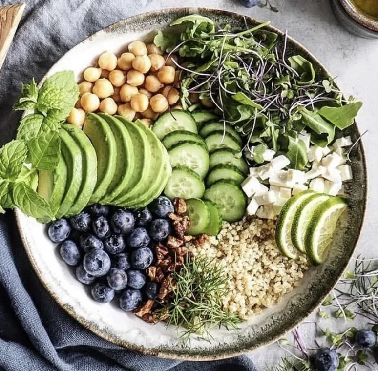 A colourful plant-based bowl with chickpeas, avocado and blueberries